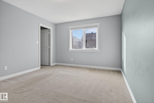 Spare room with light carpet and baseboards - 613 Stewart Crescent, Edmonton, AB - Indoor Photo Showing Other Room