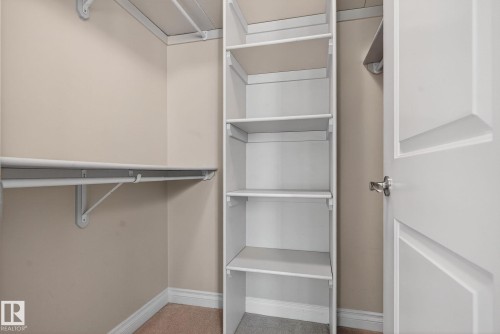 View of walk in closet - 613 Stewart Crescent, Edmonton, AB - Indoor With Storage