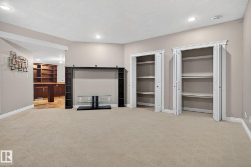 Unfurnished living room with light carpet and recessed lighting - 613 Stewart Crescent, Edmonton, AB - Indoor