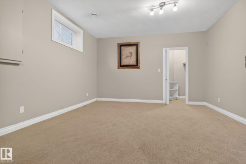 Empty room with light carpet and baseboards - 613 Stewart Crescent, Edmonton, AB - Indoor Photo Showing Other Room
