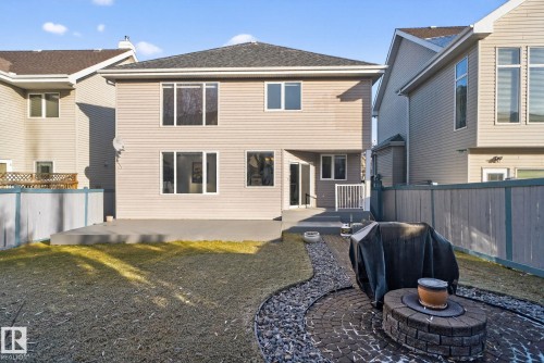 Rear view of house featuring a patio, a fenced backyard, and roof with shingles - 613 Stewart Crescent, Edmonton, AB - Outdoor With Exterior