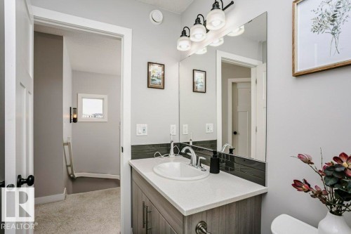 Bathroom featuring vanity and light carpet - 6710 Cardinal Road, Edmonton, AB - Indoor Photo Showing Bathroom