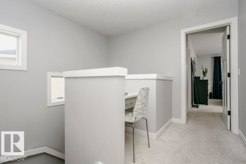 Unfurnished office featuring light carpet and a textured ceiling - 6710 Cardinal Road, Edmonton, AB - Indoor Photo Showing Other Room