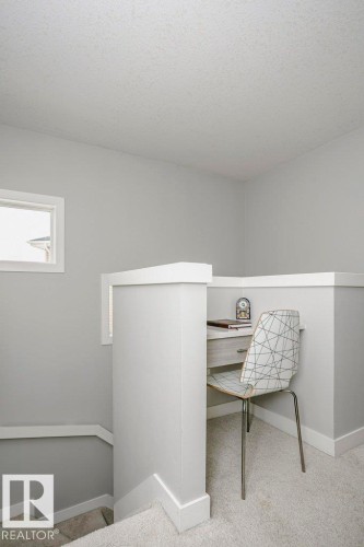 Office space featuring light colored carpet and baseboards - 6710 Cardinal Road, Edmonton, AB - Indoor