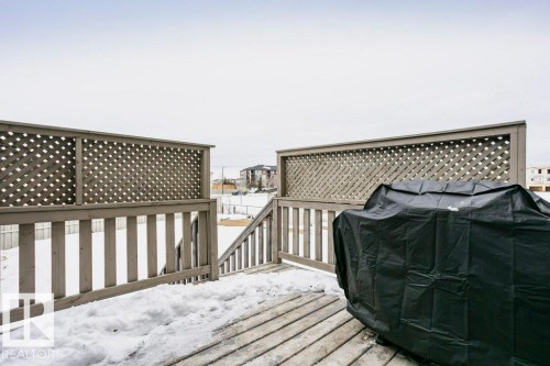 Snow covered deck featuring area for grilling - 6710 Cardinal Road, Edmonton, AB - Outdoor With Deck Patio Veranda