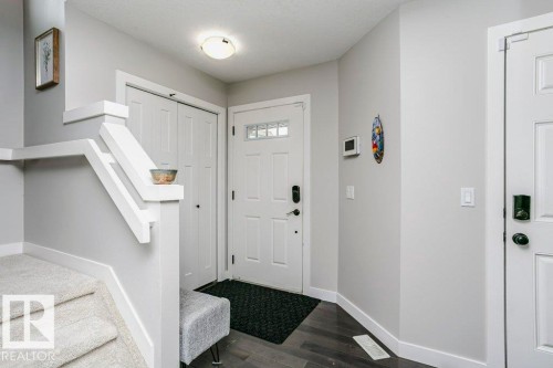 Entryway featuring baseboards and dark wood-style flooring - 6710 Cardinal Road, Edmonton, AB - Indoor Photo Showing Other Room