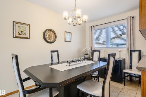 Dining area with suspended lighting and light tile patterned floors - 13420 113A St, Edmonton, AB - Indoor