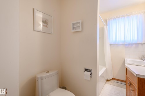 Full bath with vanity and shower / tub combo with curtain - 13420 113A St, Edmonton, AB - Indoor Photo Showing Bathroom