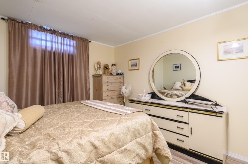 Bedroom featuring light wood-type flooring and ornamental molding - 13420 113A St, Edmonton, AB - Indoor Photo Showing Bedroom