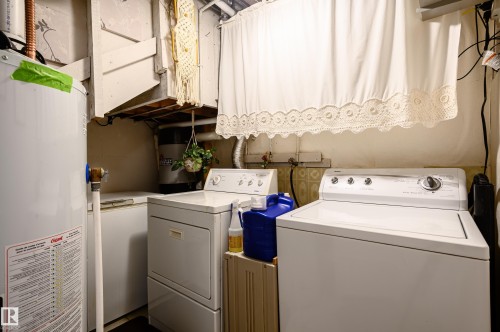 Laundry room with gas water heater and washer and clothes dryer - 13420 113A St, Edmonton, AB - Indoor Photo Showing Laundry Room