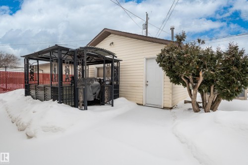 Yard layered in snow featuring a deck - 13420 113A St, Edmonton, AB - Outdoor