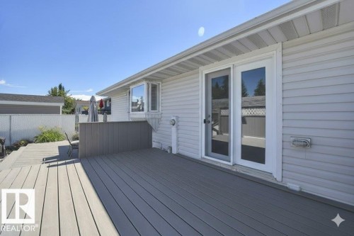 View of wooden deck - 4406 39 Ave, Leduc, AB - Outdoor With Deck Patio Veranda With Exterior