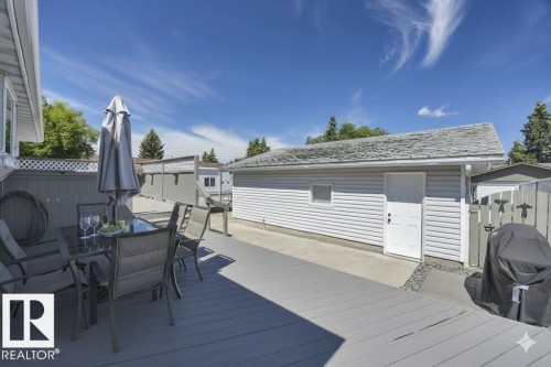 Deck featuring grilling area and outdoor dining area - 4406 39 Ave, Leduc, AB - Outdoor With Exterior