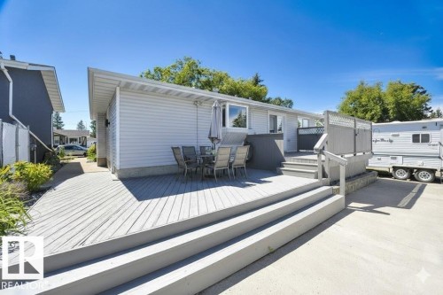 Wooden deck with outdoor dining space - 4406 39 Ave, Leduc, AB - Outdoor With Deck Patio Veranda With Exterior