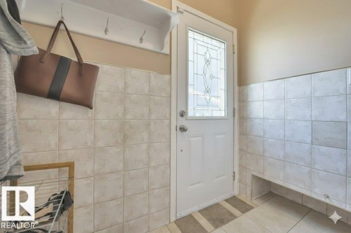 Mudroom with tile walls and tile patterned flooring - 4406 39 Ave, Leduc, AB - Indoor
