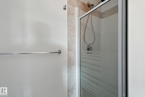 Full bathroom featuring a stall shower - 7836 7 Avenue, Edmonton, AB - Indoor Photo Showing Bathroom