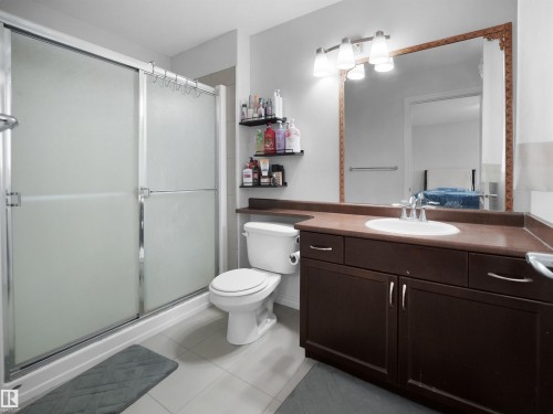 Primary Ensuite Bathroom with vanity, a shower stall, light tile patterned floors, and ensuite bathroom - 1716 64 Street, Edmonton, AB - Indoor Photo Showing Bathroom