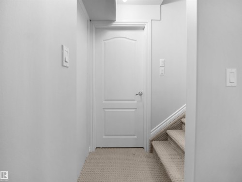 Stairs featuring baseboards - 1716 64 Street, Edmonton, AB - Indoor Photo Showing Other Room