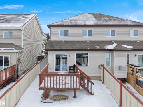 Snow covered property with a shingled roof and a wooden deck - 1716 64 Street, Edmonton, AB - Outdoor With Deck Patio Veranda With Exterior