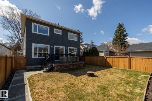Back of property featuring a gate, a fenced backyard, and a deck - 10936 71 Avenue, Edmonton, AB - Outdoor With Deck Patio Veranda
