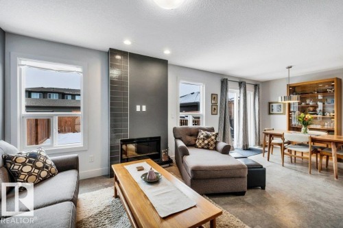 Living area featuring recessed lighting and a textured ceiling - 6485 King Wynd, Edmonton, AB - Indoor Photo Showing Living Room