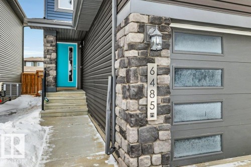 Doorway to property featuring stone siding - 6485 King Wynd, Edmonton, AB - Outdoor
