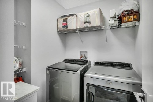Laundry area with independent washer and dryer - 6485 King Wynd, Edmonton, AB - Indoor Photo Showing Laundry Room