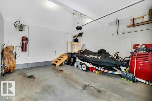 Garage featuring a central vacuum unit and a heating unit - 6485 King Wynd, Edmonton, AB - Indoor Photo Showing Garage