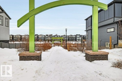 Yard layered in snow with a residential view - 6485 King Wynd, Edmonton, AB - Outdoor