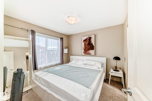 Bedroom featuring carpet flooring - 403 340 Windermere Road, Edmonton, AB - Indoor Photo Showing Bedroom