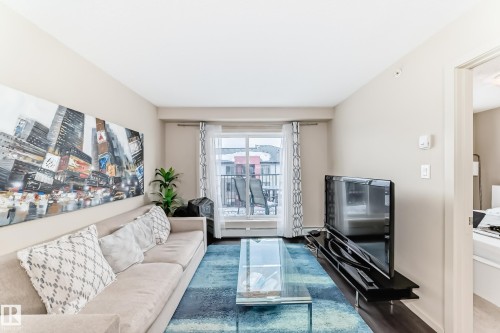 Living area with wood finished floors - 403 340 Windermere Road, Edmonton, AB - Indoor Photo Showing Living Room