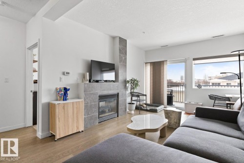 408 11203 103A Avenue, Edmonton, AB - Indoor Photo Showing Living Room With Fireplace