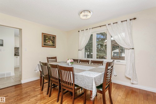 Dining room featuring light wood-type flooring and a textured ceiling - 18507 92 Avenue, Edmonton, AB - Indoor Photo Showing Dining Room