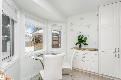 Dining space featuring light tile patterned floors and baseboards - 18507 92 Avenue, Edmonton, AB - Indoor Photo Showing Other Room