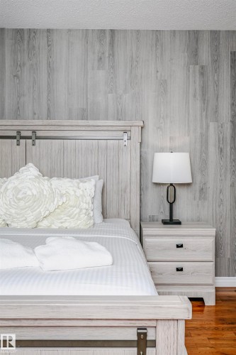 Bedroom featuring a textured ceiling and wood finished floors - 18507 92 Avenue, Edmonton, AB - Indoor Photo Showing Bedroom