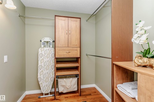 Walk in closet with light wood-style flooring - 18507 92 Avenue, Edmonton, AB - Indoor