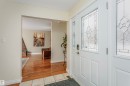 Foyer entrance featuring a textured ceiling and light tile patterned flooring - 18507 92 Avenue, Edmonton, AB  - Indoor Photo Showing Other Room 