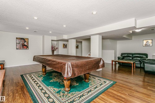Game room with billiards table, a textured ceiling, dark wood finished floors, and recessed lighting - 18507 92 Avenue, Edmonton, AB - Indoor Photo Showing Other Room