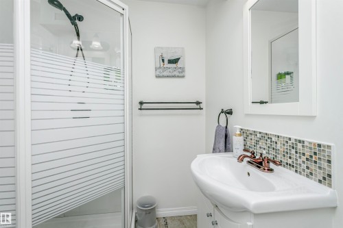 Full bathroom featuring vanity, a stall shower, and backsplash - 18507 92 Avenue, Edmonton, AB - Indoor Photo Showing Bathroom