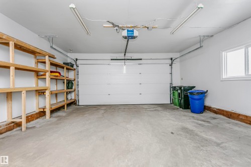 Garage featuring a garage door opener - 18507 92 Avenue, Edmonton, AB - Indoor Photo Showing Garage