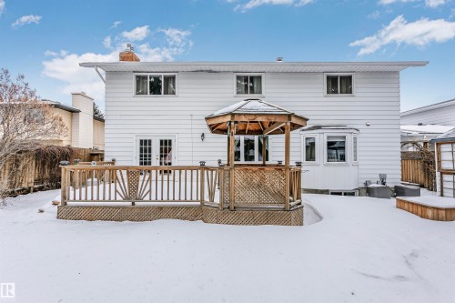Snow covered house with a gazebo, a deck, and a chimney - 18507 92 Avenue, Edmonton, AB - Outdoor With Exterior