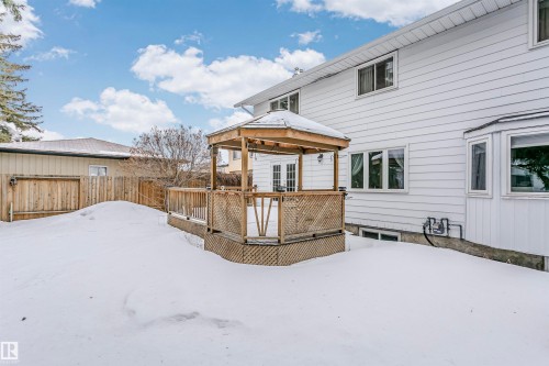 Snow covered property featuring a gazebo and a wooden deck - 18507 92 Avenue, Edmonton, AB - Outdoor With Exterior