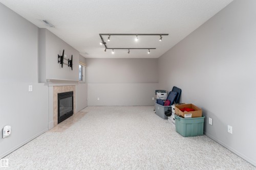 174 Oeming Road, Edmonton, AB - Indoor Photo Showing Other Room With Fireplace