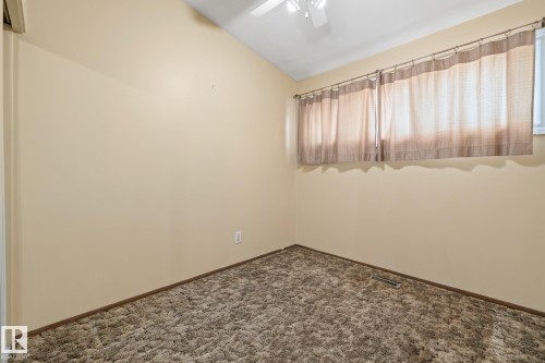 beroom with lofted ceiling, dark carpet, and ceiling fan - 10971 157 Street, Edmonton, AB - Indoor Photo Showing Other Room
