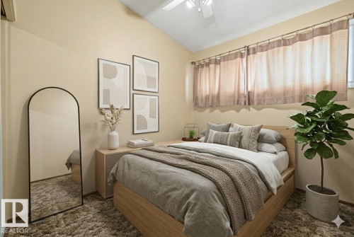 Bedroom with lofted ceiling, a ceiling fan, and dark colored carpet - 10971 157 Street, Edmonton, AB - Indoor Photo Showing Bedroom
