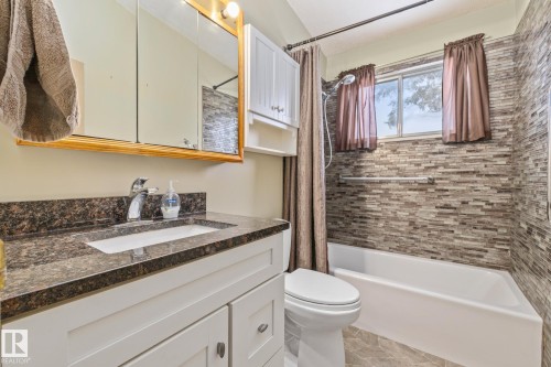 Full bath with vanity and shower / bathtub combination with curtain - 10971 157 Street, Edmonton, AB - Indoor Photo Showing Bathroom