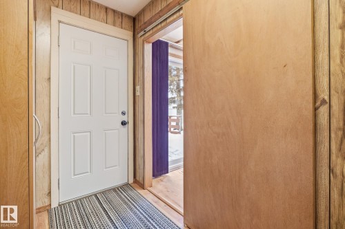 Laundry room with wooden walls - 10971 157 Street, Edmonton, AB - Indoor Photo Showing Other Room