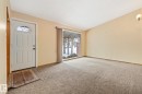 Foyer entrance with light colored carpet and a textured ceiling - 10971 157 Street, Edmonton, AB  - Indoor Photo Showing Other Room 