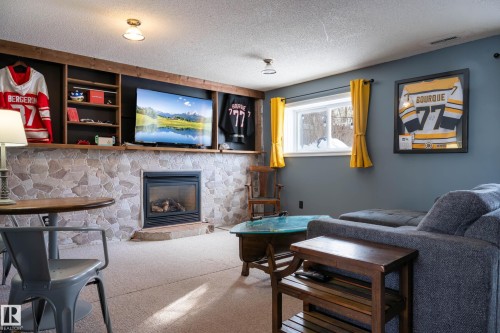 2009 4 Avenue, Cold Lake, AB - Indoor Photo Showing Other Room With Fireplace