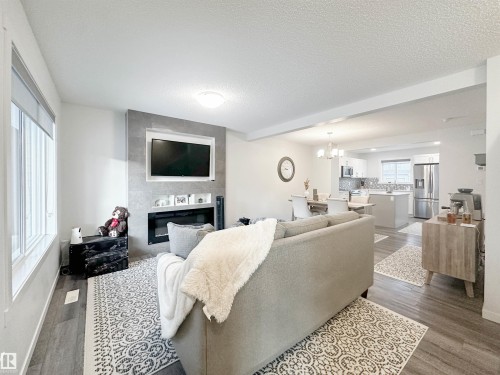 1270 Rosenthal Boulevard, Edmonton, AB - Indoor Photo Showing Living Room With Fireplace